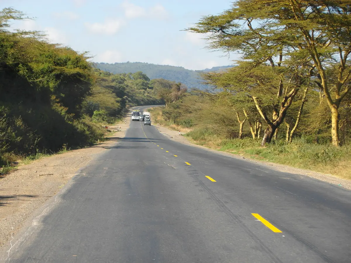 Paved road from Nairobi to Naivasha lined with acacia trees